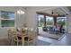 Dining room featuring elegant decor, view to the backyard, and modern lighting fixture at 2260 Grayling St, Orlando, FL 32820