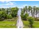 Scenic aerial view of a dock leading to a beautiful, serene lake at 2260 Grayling St, Orlando, FL 32820