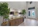 Inviting entryway featuring a console table, decor, neutral paint, and double entry doors with glass detail at 2260 Grayling St, Orlando, FL 32820