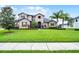 Charming two-story home with well-maintained lawn and lush landscaping, creating great curb appeal at 2260 Grayling St, Orlando, FL 32820