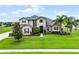 Beautiful two-story home featuring manicured landscaping and a large front yard at 2260 Grayling St, Orlando, FL 32820