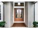 Elegant double front doors with decorative glass inserts and a transom window above at 2260 Grayling St, Orlando, FL 32820