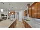 Spacious kitchen with granite countertops, stainless steel appliances and breakfast bar seating at 2260 Grayling St, Orlando, FL 32820