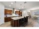 Well-lit kitchen with stainless steel appliances, backsplash and a large island at 2260 Grayling St, Orlando, FL 32820