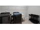 Functional laundry room with modern washer and dryer, utility sink, and storage at 2260 Grayling St, Orlando, FL 32820
