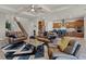 Open-concept living space features modern furniture, an open staircase, and a gourmet kitchen at 2260 Grayling St, Orlando, FL 32820