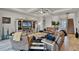 Bright and open living space features an entertainment center, comfortable seating, and a staircase at 2260 Grayling St, Orlando, FL 32820