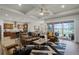 Open-concept living room with coffered ceilings, tile floors, and access to the outdoor living area at 2260 Grayling St, Orlando, FL 32820
