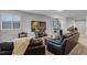 Comfortable living room boasts plush leather seating, a large television, and natural light at 2260 Grayling St, Orlando, FL 32820