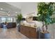 Open concept living room with modern furnishings, wood-look tile flooring, and neutral paint at 2260 Grayling St, Orlando, FL 32820