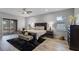 Spacious main bedroom boasts a luxurious king bed, a large window, and a sliding glass door with backyard views at 2260 Grayling St, Orlando, FL 32820