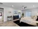 A spacious main bedroom features an area rug, stylish decor, and wood-look tile flooring at 2260 Grayling St, Orlando, FL 32820