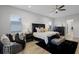 Spacious main bedroom boasts a luxurious king bed, a large window, and furniture at 2260 Grayling St, Orlando, FL 32820