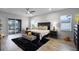 Spacious main bedroom boasts a luxurious king bed, a large window, and a sliding glass door with backyard views at 2260 Grayling St, Orlando, FL 32820