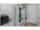 Mud room features custom shelving with space for sitting, storage, and a laundry room at 2260 Grayling St, Orlando, FL 32820