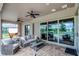 Inviting covered patio with stylish furniture, ceiling fans, and view to spacious outdoor area at 2260 Grayling St, Orlando, FL 32820