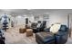 Open living room features modern exercise equipment, stylish seating, and a wet bar for relaxation at 2260 Grayling St, Orlando, FL 32820