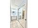 Bathroom view featuring double sinks, mirrors, and sliding glass shower doors at 2316 E Margarita Ct, Kissimmee, FL 34741