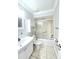Bathroom featuring a toilet, vanity, medicine cabinet, and shower-tub with glass door at 2316 E Margarita Ct, Kissimmee, FL 34741