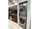 Convenient stackable washer and dryer located next to a renovated kitchen with stainless steel appliances at 2316 E Margarita Ct, Kissimmee, FL 34741