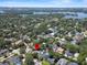 Aerial view showcasing a home's location near a beautiful lake, surrounded by lush greenery in a suburban setting at 2339 Lafayette Ave, Winter Park, FL 32789