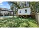 Beautiful backyard featuring a treehouse, pool, and lovely landscaping at 2339 Lafayette Ave, Winter Park, FL 32789