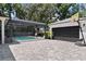 Backyard featuring a pool area, a screened-in porch, and a basketball hoop by the garage at 2339 Lafayette Ave, Winter Park, FL 32789