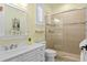 Bathroom with a white vanity, glass shower enclosure, and neutral tile at 2339 Lafayette Ave, Winter Park, FL 32789