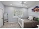 Neutrally decorated bedroom featuring a white bed frame, shutters, and a full-length mirror at 2339 Lafayette Ave, Winter Park, FL 32789