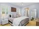 Serene bedroom with natural light, plantation shutters, and a full-length mirror at 2339 Lafayette Ave, Winter Park, FL 32789