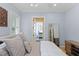 Bright bedroom with neutral tones, window with shutters and view to the bathroom at 2339 Lafayette Ave, Winter Park, FL 32789