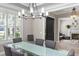 Elegant dining room with tray ceiling, chandelier, and a clear view into the living room at 2339 Lafayette Ave, Winter Park, FL 32789
