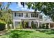 Charming two-story home featuring a well-manicured lawn, landscaping, and a quaint porch at 2339 Lafayette Ave, Winter Park, FL 32789