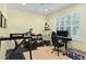Home office featuring exercise equipment, a large window, and an ergonomic workstation at 2339 Lafayette Ave, Winter Park, FL 32789