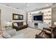 Cozy living room features recessed lighting, a ceiling fan, and an entertainment center with ample storage at 2339 Lafayette Ave, Winter Park, FL 32789