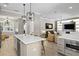 Open floorplan connecting kitchen to living room, featuring built-in shelves and comfortable seating at 2339 Lafayette Ave, Winter Park, FL 32789