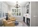 Cozy sitting area with wine storage and natural light from plantation-shuttered windows at 2339 Lafayette Ave, Winter Park, FL 32789
