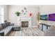 Comfortable living room features a fireplace, a wall-mounted TV, and a cozy seating area for relaxing at 2339 Lafayette Ave, Winter Park, FL 32789