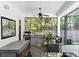 An outdoor kitchen with a grill, hot tub, beverage cooler, and ceiling fan for all your entertaining needs at 2339 Lafayette Ave, Winter Park, FL 32789