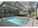 A screened-in pool and treehouse create an oasis in this landscaped backyard at 2339 Lafayette Ave, Winter Park, FL 32789