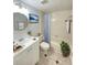 Well-lit bathroom with a framed mirror, modern vanity, bathtub, and tiled walls at 2468 Citrus Club Ln # 502, Orlando, FL 32839