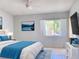 Comfortable bedroom featuring neutral walls, plush bedding, and a window view at 2468 Citrus Club Ln # 502, Orlando, FL 32839