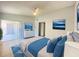 Bright bedroom featuring tile floors, sliding glass doors, and a ceiling fan at 2468 Citrus Club Ln # 502, Orlando, FL 32839