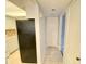 Hallway view with kitchen access, modern appliances, and sleek design elements at 2468 Citrus Club Ln # 502, Orlando, FL 32839