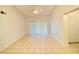 Spacious living area featuring neutral-toned walls, ceiling fan, and sliding doors to give a clean feel at 2468 Citrus Club Ln # 502, Orlando, FL 32839