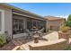 Landscaped patio area with comfortable seating for relaxing and entertaining at 2554 Stargrass Cir, Clermont, FL 34715