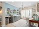 Chic bar area featuring custom cabinetry and a wine fridge at 2554 Stargrass Cir, Clermont, FL 34715