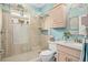 Modern bathroom featuring a glass-enclosed shower and sleek fixtures at 2554 Stargrass Cir, Clermont, FL 34715