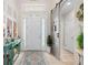 Bright foyer featuring a decorative rug and a sliding barn door at 2554 Stargrass Cir, Clermont, FL 34715