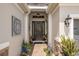 Inviting entryway with a decorative front door and stone accents at 2554 Stargrass Cir, Clermont, FL 34715